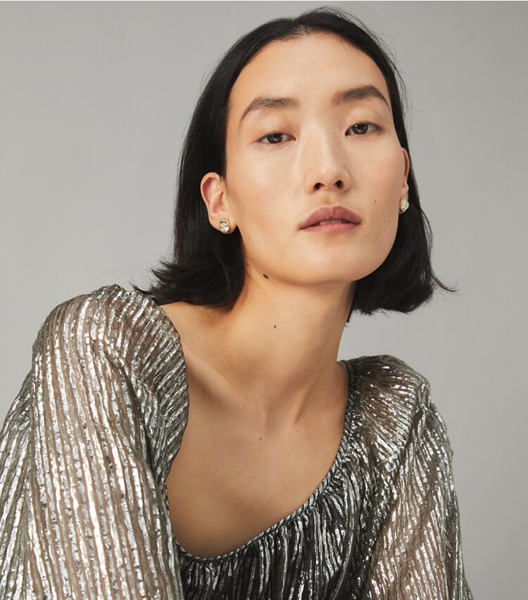 Tory Burch designer earrings Roxanne Circle-Stud Earring in Rolled Brass/Clear accessory on model