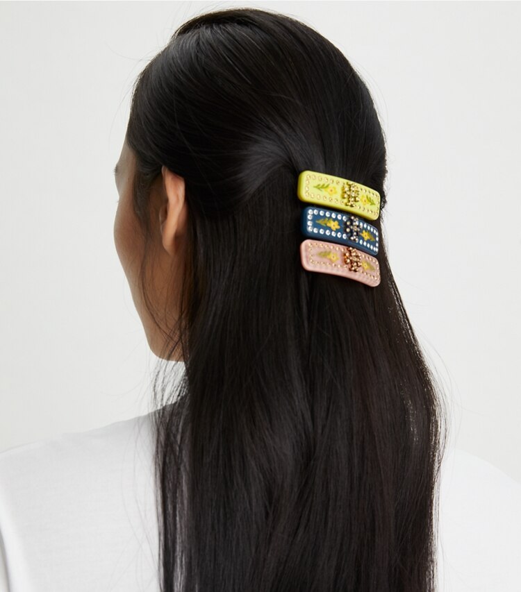 Tory Burch designer hair pins Roxanne Embellished Small Barrette in Rolled Tory Gold / Coral accessory on model
