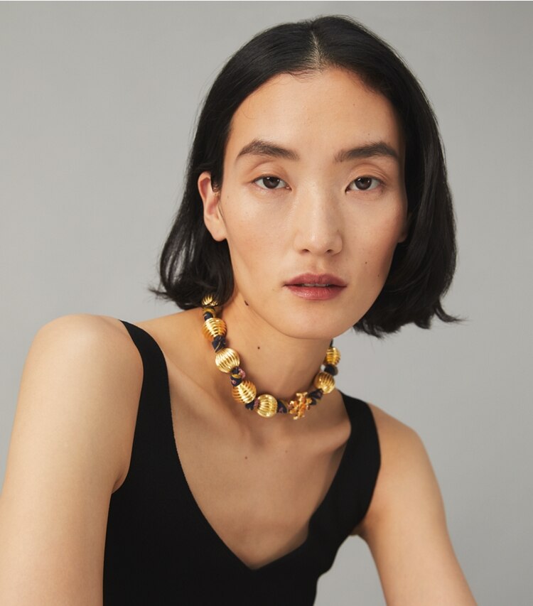 Tory Burch designer necklaces Roxanne Fluted Necklace in Rolled Gold / Multi accessory on model
