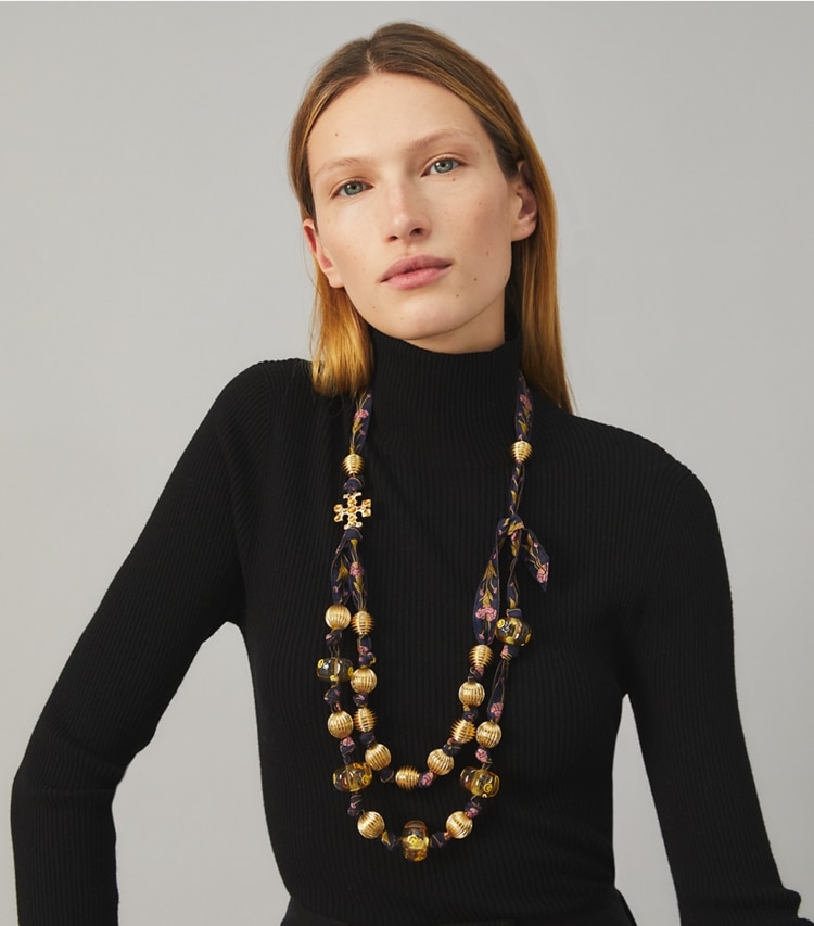 Tory Burch designer necklaces Roxanne Ribbon Necklace in Rolled Gold / Navy Multi accessory on model