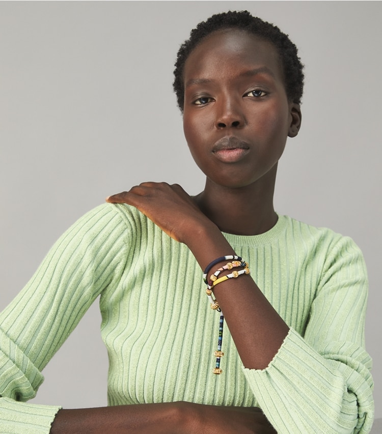 Tory Burch designer bracelets Roxanne Silk Wrap Bracelet in Rolled Gold / Spiced Chai accessory on model