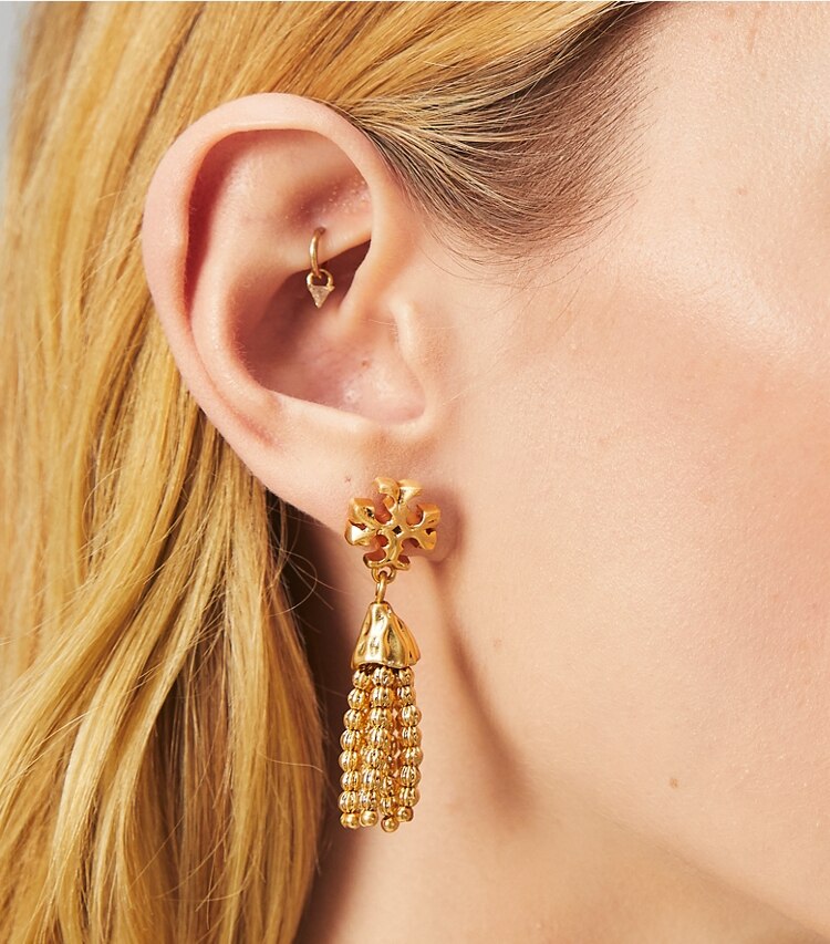 Tory Burch designer earrings Roxanne Small Tassel Earring in Rolled Brass accessory on model