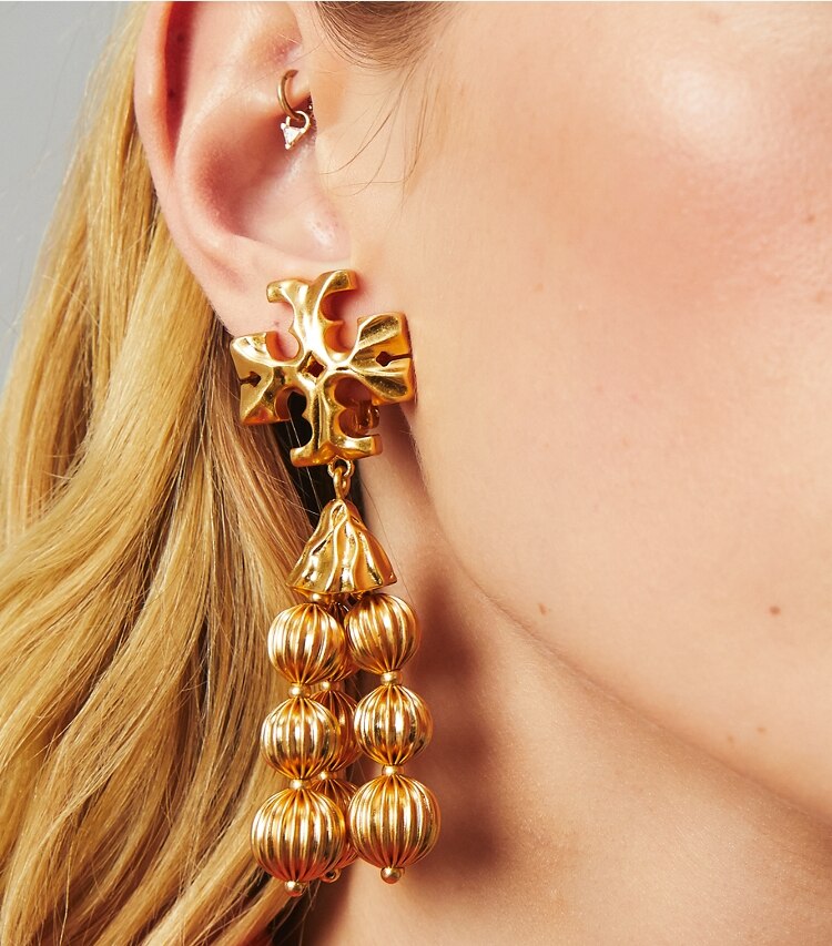 Tory Burch designer earrings Roxanne Tassel Earring in Rolled Brass accessory on model