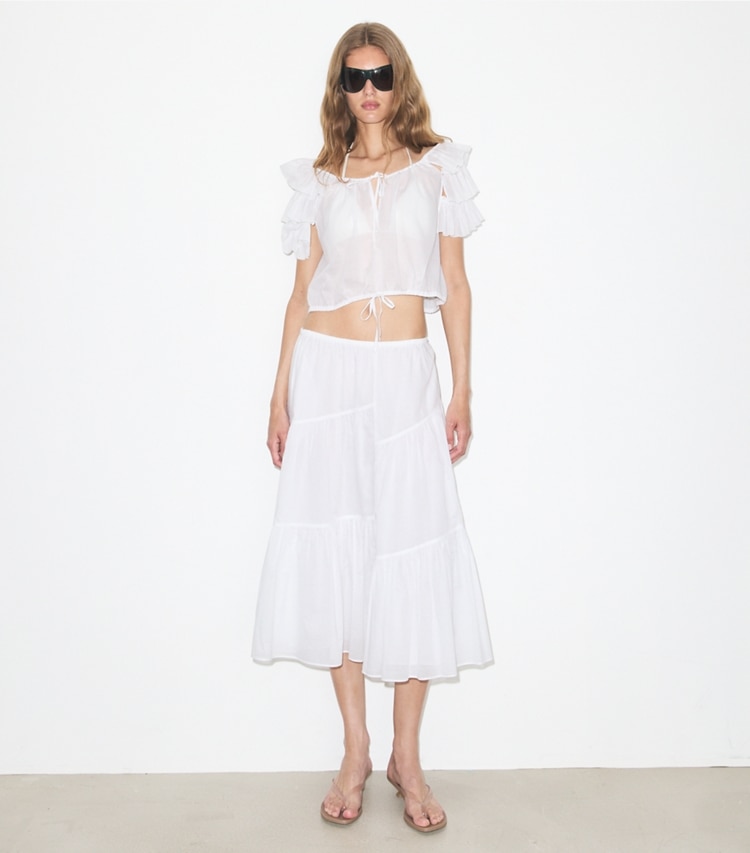 Tory Burch designer coverups Ruffle Cotton Top in White on model front