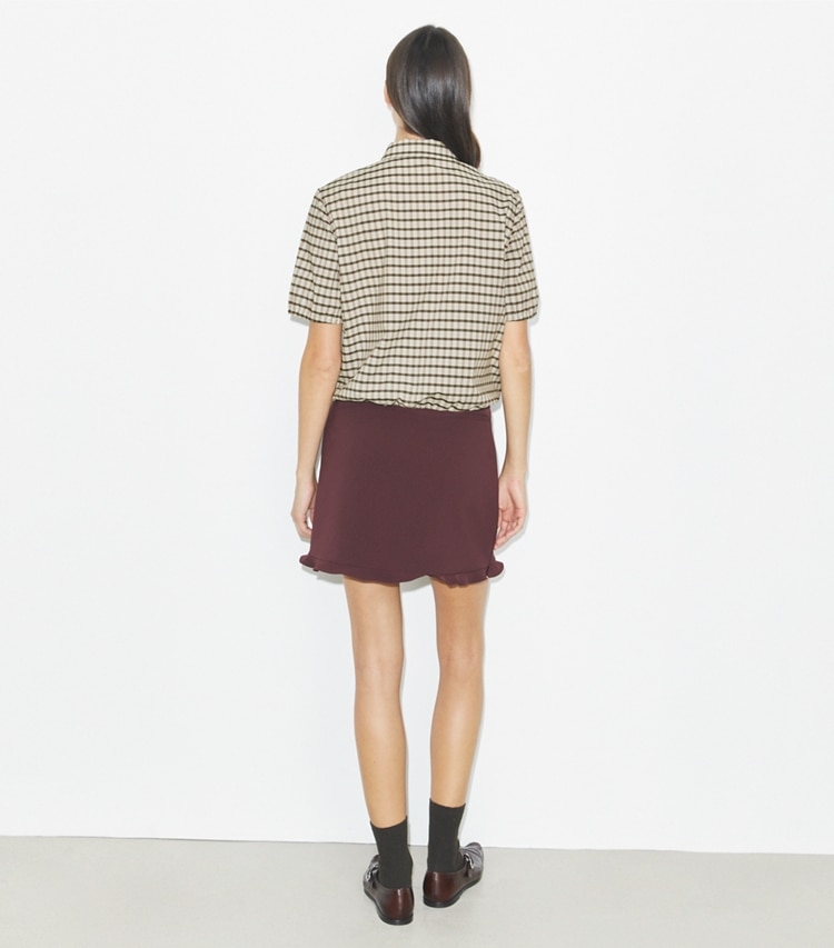 Tory Burch designer bottoms Ruffle Stretch Golf Skirt in Dark Sangria on model back