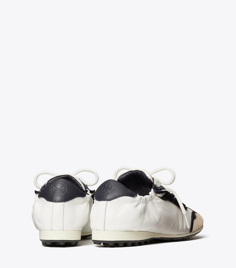 Tory Sport designer sneakers Ruffle Tory Golf Sneaker in Snow White / PERFECT NAVY angle