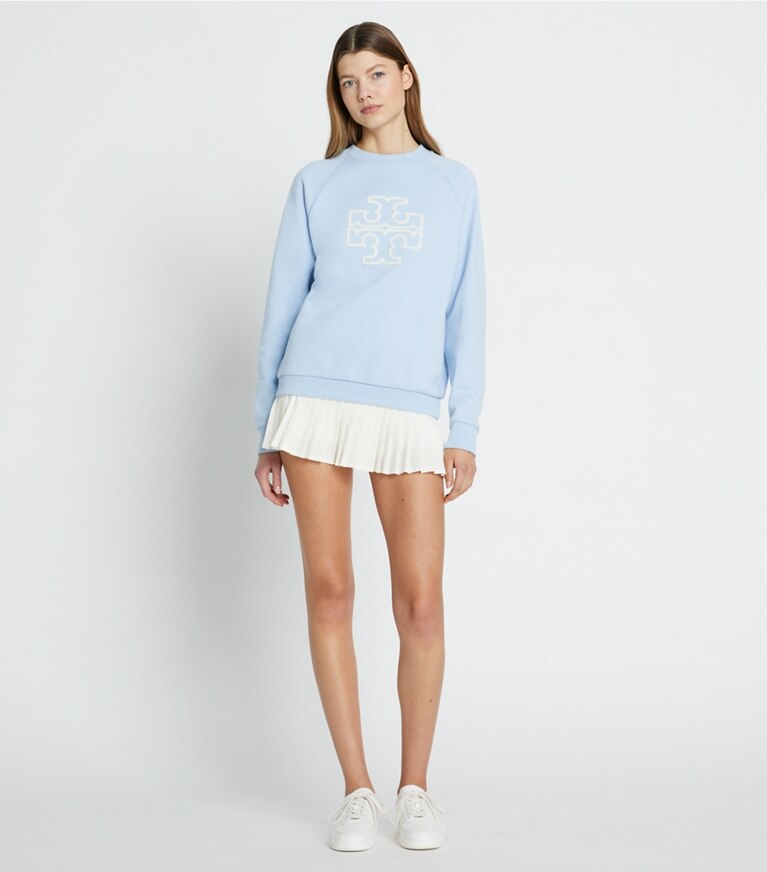 Tory Burch designer strickware Rundhalstop aus Merinofrottee mit Raglanärmeln und Logo in Ice Floe modell von vorn