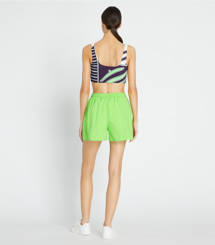 Tory Sport designer bottoms Runner's Camp Short in Vibrant Green on model back