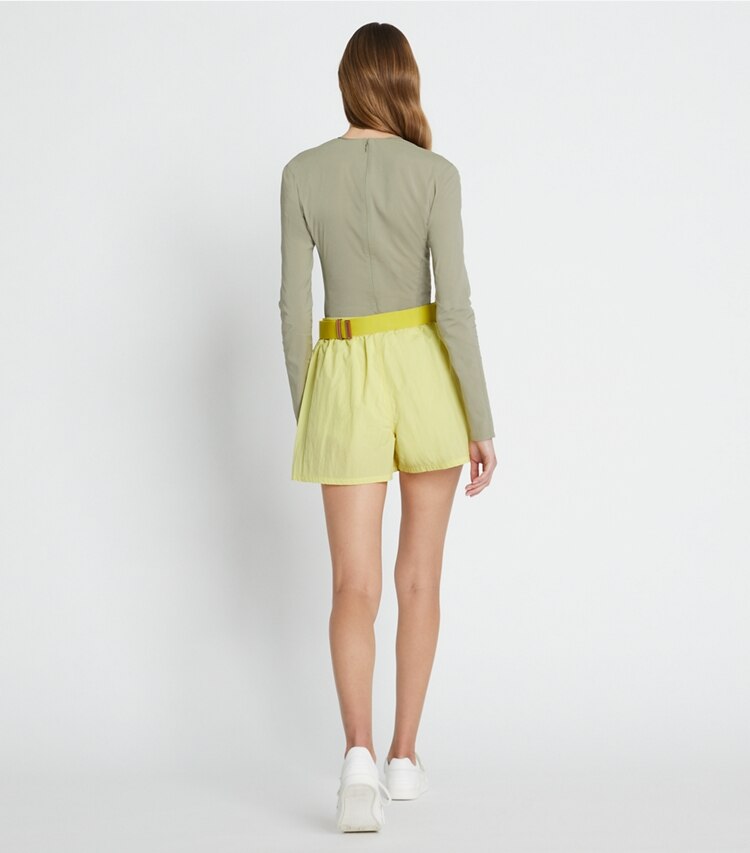 Tory Sport designer bottoms Runner's Camp Short in Yellow Dahlia on model back