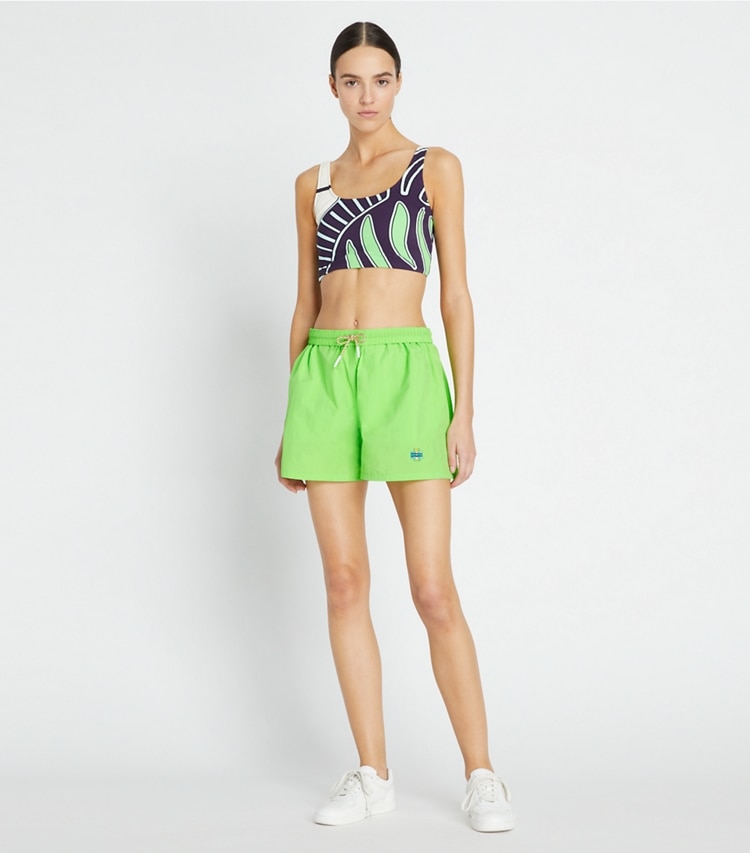 Tory Sport designer bottoms Runner's Camp Short in Vibrant Green on model front