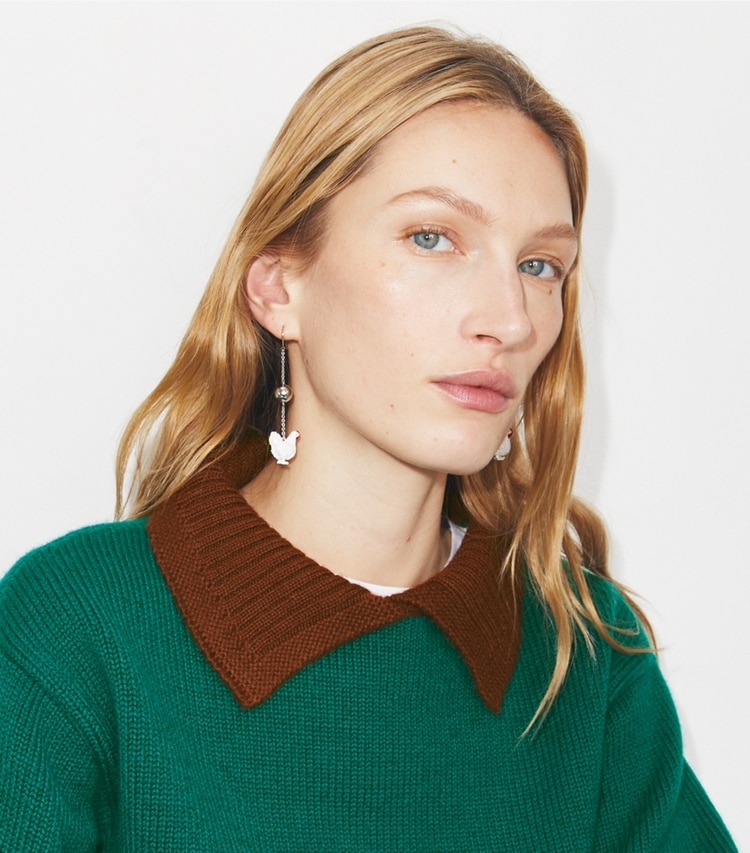 Tory Burch designer earrings Runway Chicken Earrings in White accessory on model