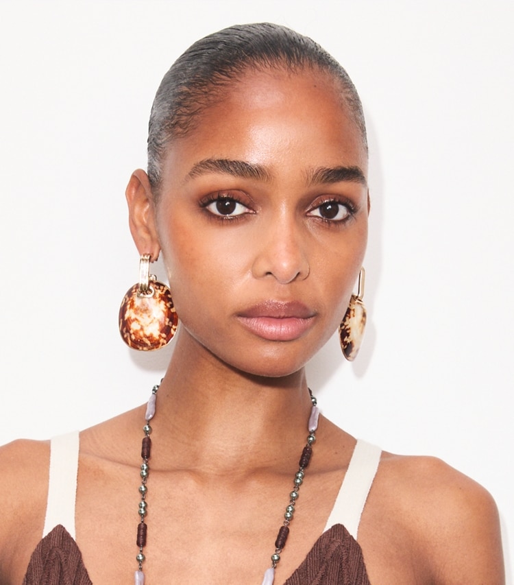 Tory Burch designer earrings Runway Shell Drop Earrings in Light Brass accessory on model