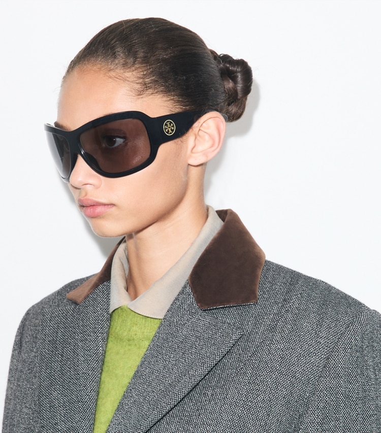Tory Burch designer sunglasses & eyewear Runway Wrap Sunglasses in BLACK/DARK GREY accessory on model
