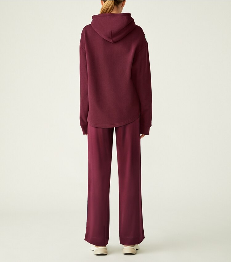 Tory Sport designer bottoms Satin Track Pant in Winetasting / Tory Navy on model back