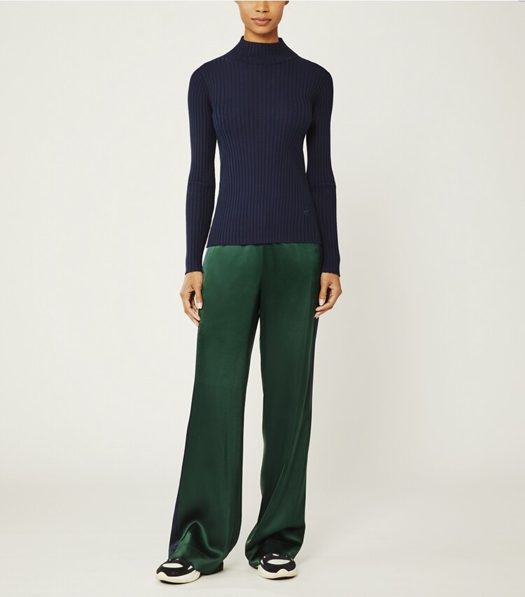 Tory Sport designer bottoms Satin Track Pant in Conifer/Tory Navy on model front