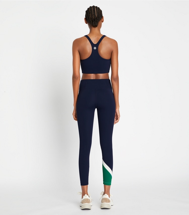 Tory Sport designer bottoms Sculpt Compression Colorblock Chevron Legging in Tory Navy / Evergreen on model back