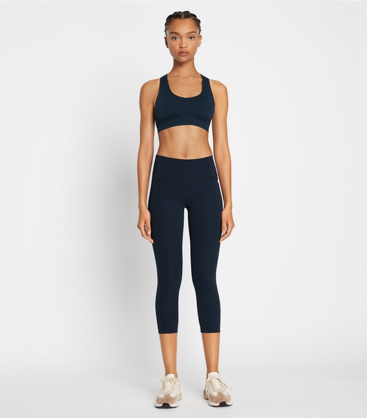 Tory Sport designer bottoms Sculpt Compression Cropped Legging in Tory Navy on model front