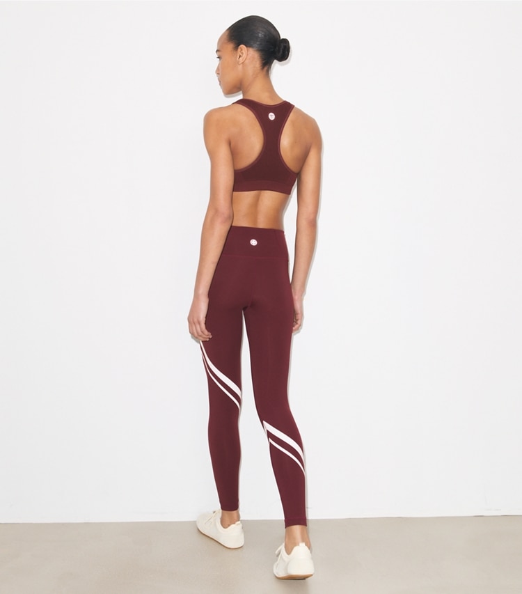 Tory Burch designer bottoms Sculpt Compression Diagonal Chevron Legging in Winetasting on model back