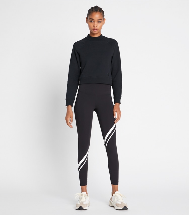 Tory Sport designer bottoms Sculpt Compression Diagonal Chevron Legging in Sport Black on model front