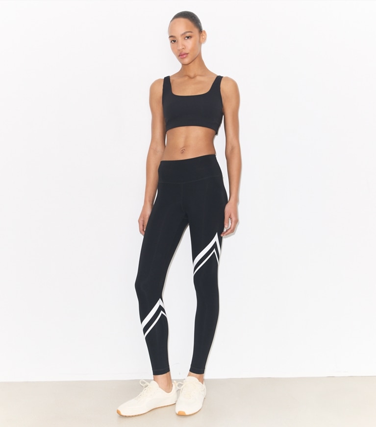 Tory Burch designer bottoms Sculpt Compression Diagonal Chevron Legging in Sport Black on model front