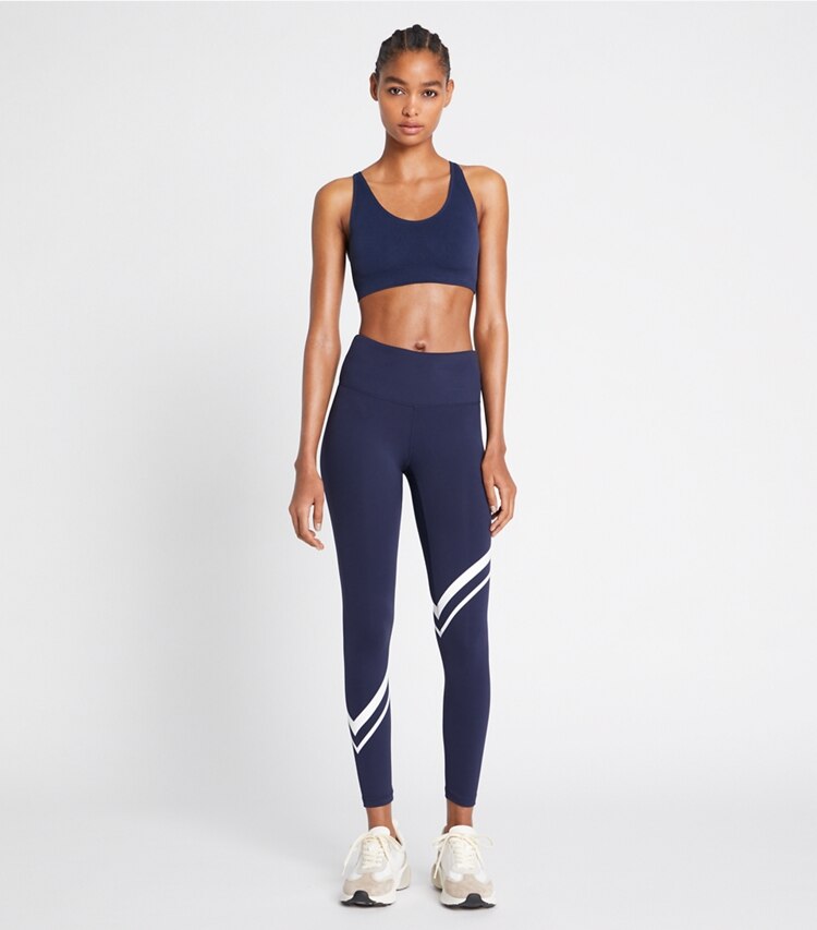 Tory Sport designer bottoms Sculpt Compression Diagonal Chevron Legging in Tory Navy on model front