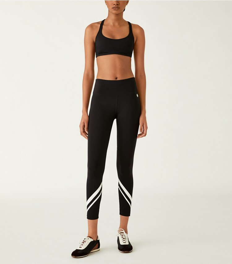 Tory Sport designer sports bras Sculpt Compression Racerback Bra in Sport Black on model front