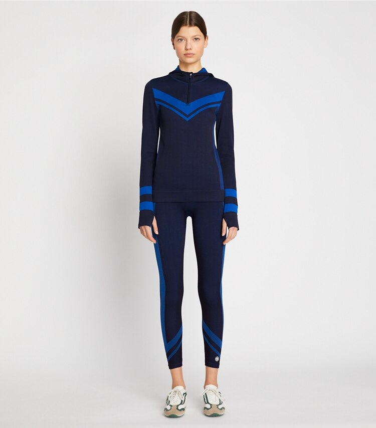 Tory Sport designer tops Seamless Half-Zip Chevron Long-Sleeve Top in Tory Navy/Royale Double Dye on model front