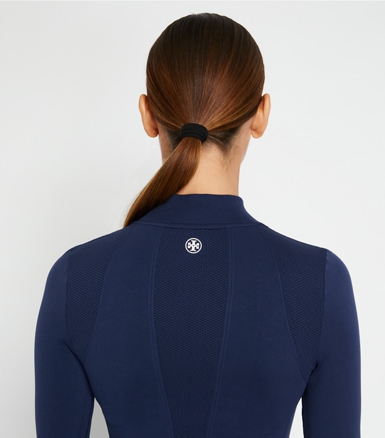 Tory Sport designer tops Seamless Half-Zip Pullover in Tory Navy on model detail