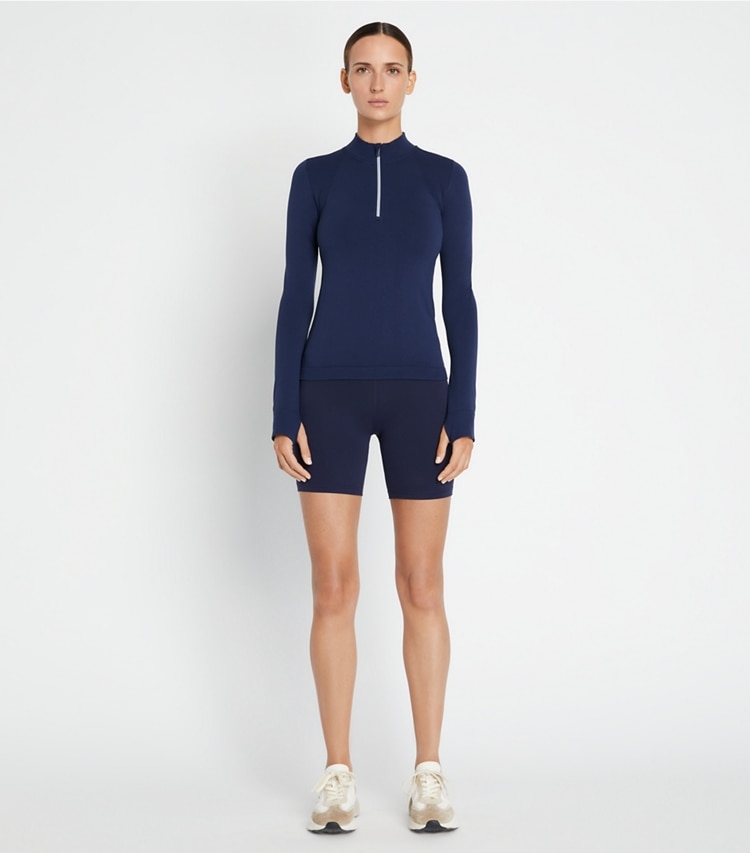 Tory Sport designer tops Seamless Half-Zip Pullover in Tory Navy on model front