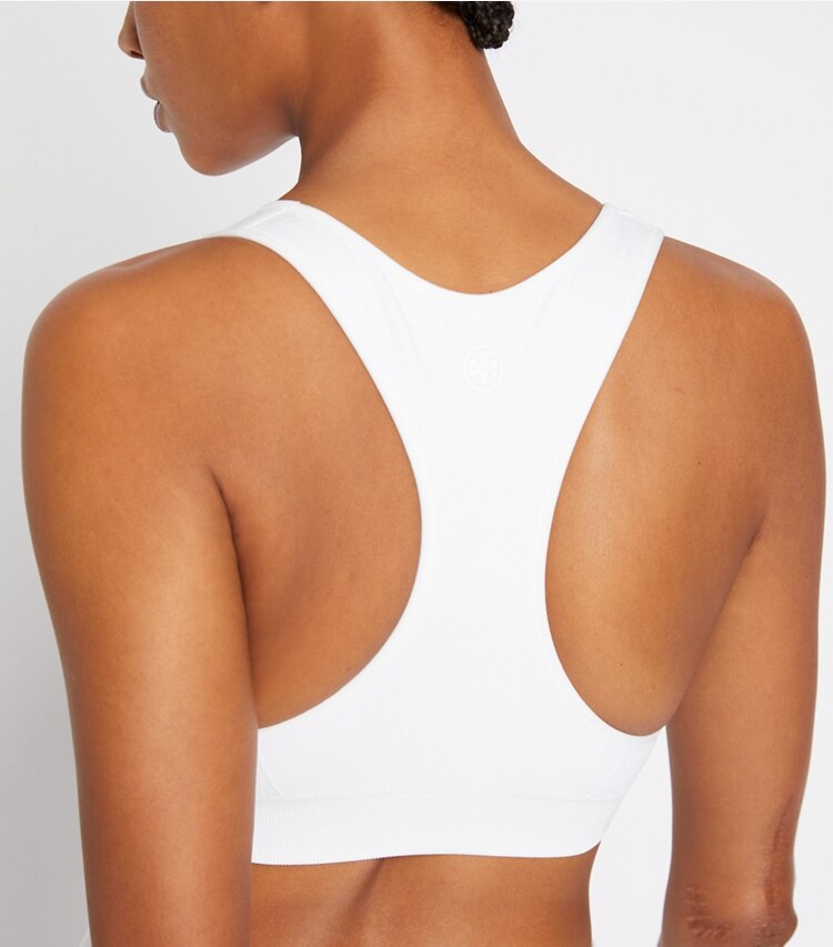 Tory Sport designer sports bras Seamless Racerback Bra in Snow White on model detail