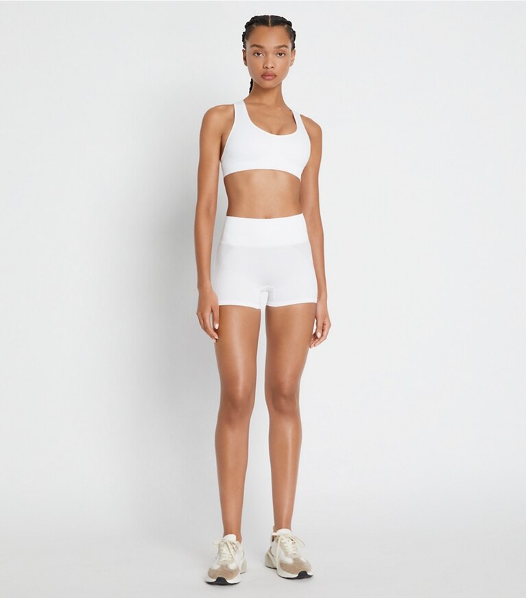 https://s7.toryburch.com/is/image/ToryBurch/style/seamless-short-on-model-front.TB_73677_047_20220428_OMFRO.pdp-767x872.jpg