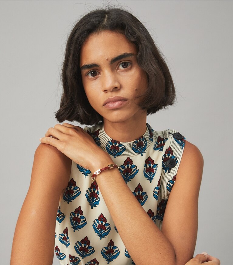 Tory Burch designer bracelets Serif-T Stackable Croc Embossed Bracelet in Tory Gold / Jamaica Sand accessory on model