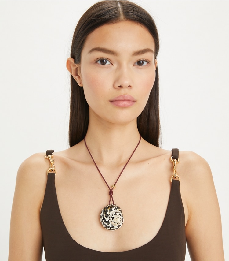 Tory Burch designer necklaces Shell Pendant in Black / White accessory on model
