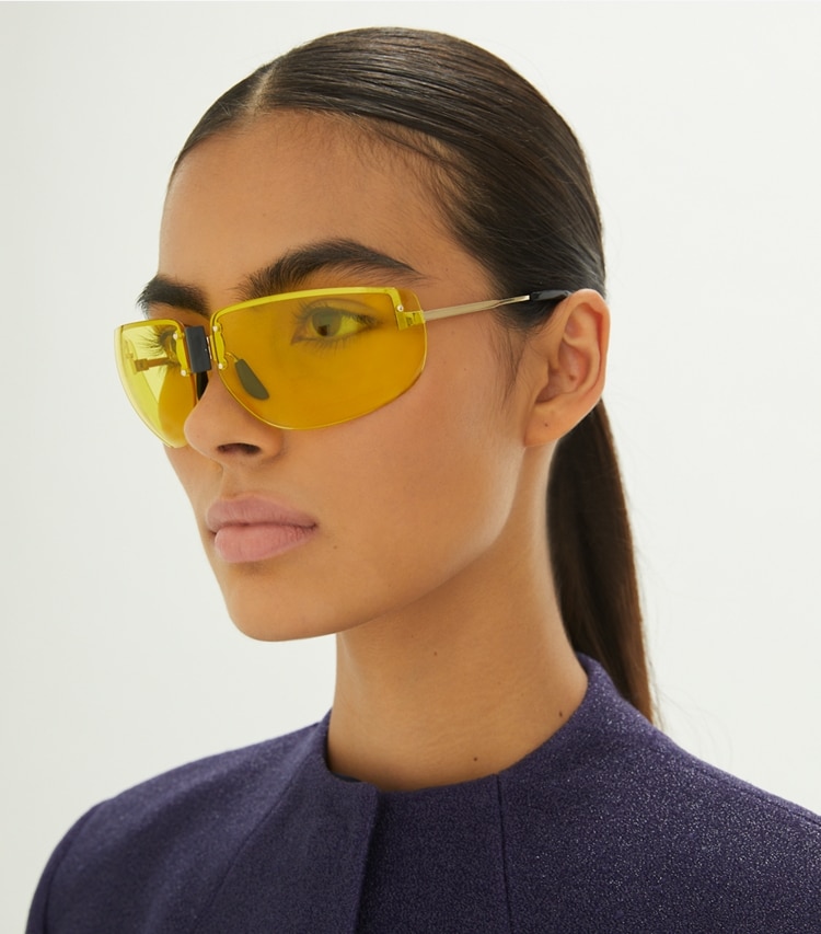 Tory Burch designer sunglasses & eyewear Shield Runway Sunglasses in SHINY GOLD/BROWN accessory on model