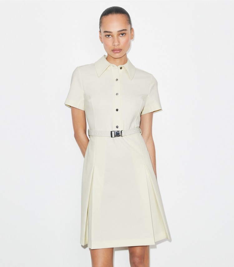 Tory Burch designer dresses Short-Sleeve Pleated Golf Dress in NEW IVORY on model detail