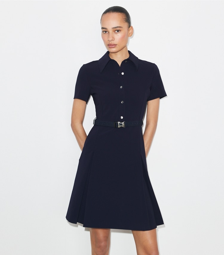 Tory Burch designer dresses Short-Sleeve Pleated Golf Dress in Tory Navy on model detail