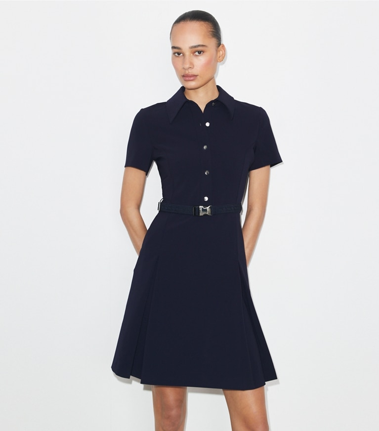 Tory Burch designer dresses Short-Sleeve Pleated Golf Dress in Tory Navy on model detail
