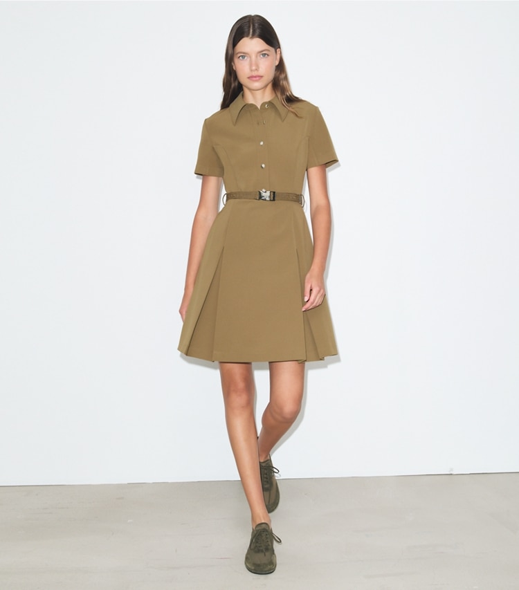 Tory Burch designer dresses Short-Sleeve Pleated Golf Dress in Olive on model front