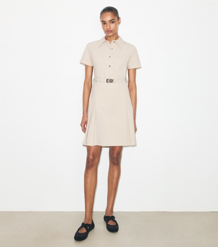 Tory Burch designer dresses Short-Sleeve Pleated Golf Dress in Stone on model front