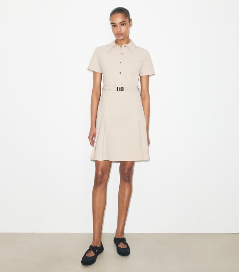 Tory Burch designer dresses Short-Sleeve Pleated Golf Dress in Stone on model front