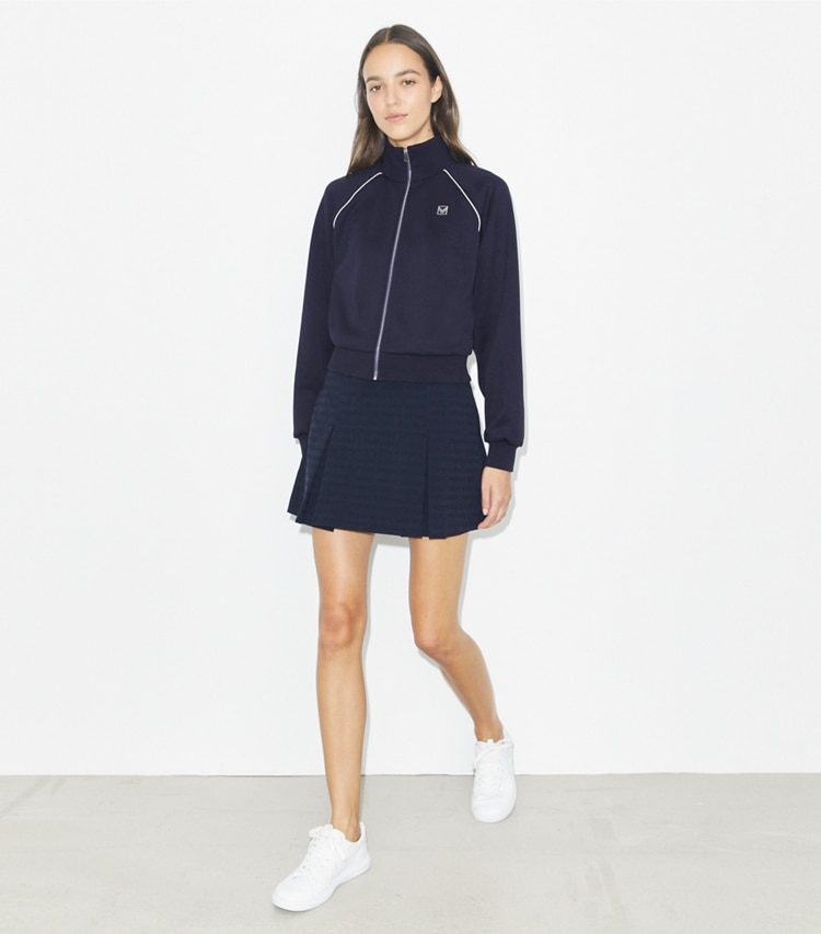 Tory Burch designer jackets Shrunken Track Jacket in Medium Navy on model front