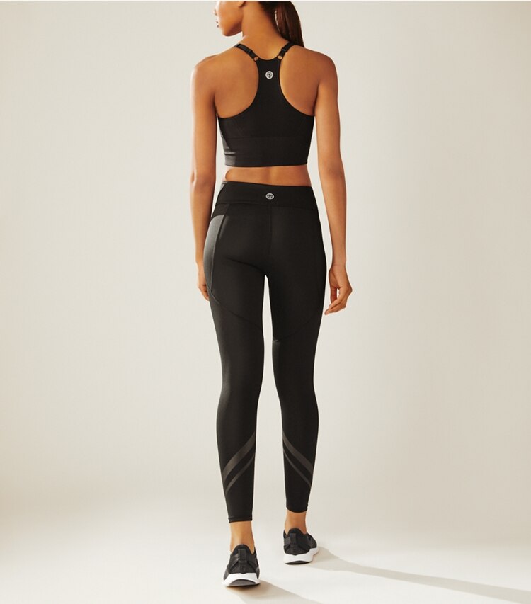 Tory Sport designer bottoms Side-Pocket Chevron Leggings in Sport Black on model back