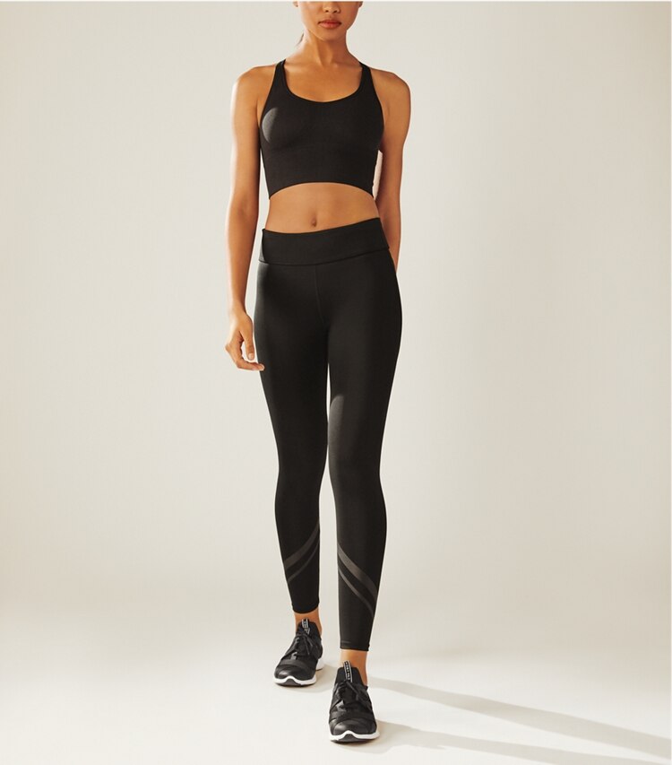 Tory Sport designer bottoms Side-Pocket Chevron Leggings in Sport Black on model front