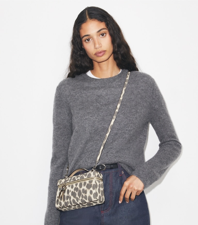 Tory Burch designer mini bags Slim Romy Suede Top Handle in Cheetah Spots accessory on model