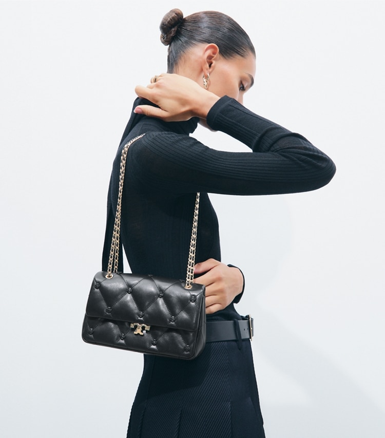 Tory Burch designer shoulder bags Small Bunny Knot Shoulder Bag in BLACK/GOLD accessory on model