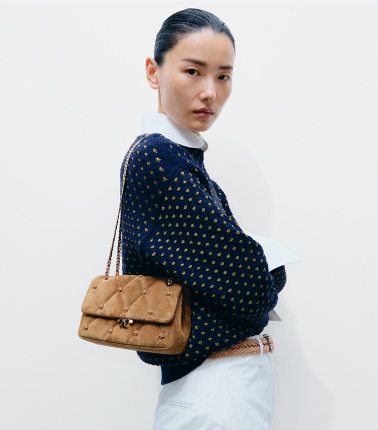 Tory Burch designer shoulder bags Small Bunny Knot Suede Shoulder Bag in Toffee accessory on model