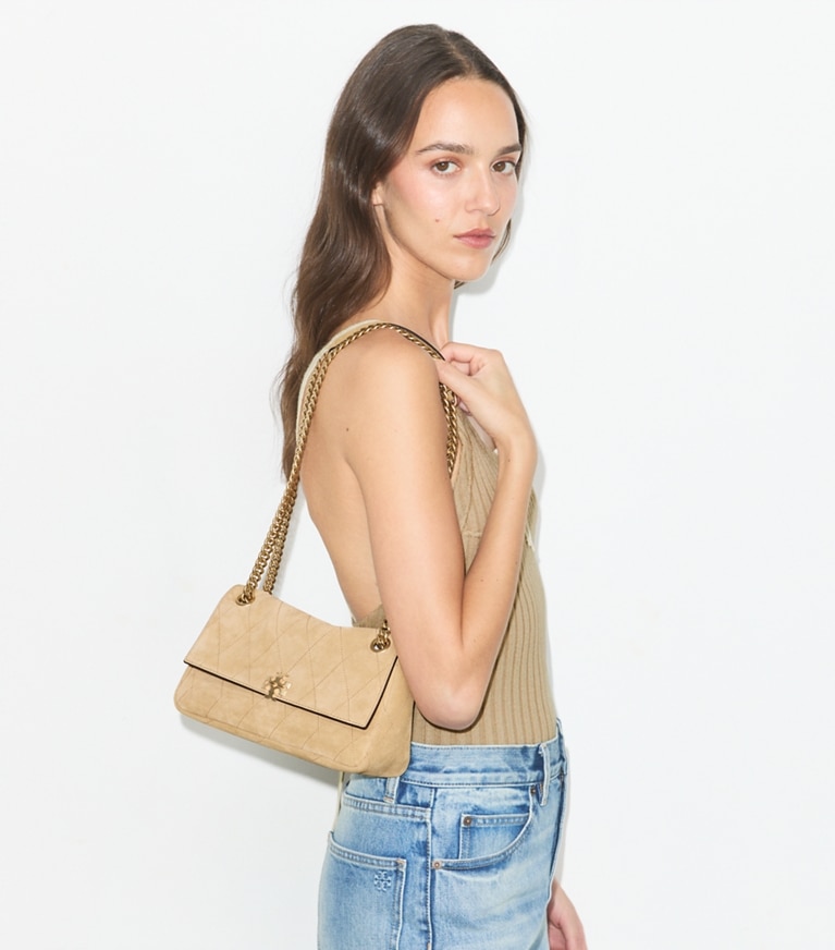 Tory Burch designer shoulder bags Small Charlie Quilted Suede Shoulder Bag in Stone accessory on model