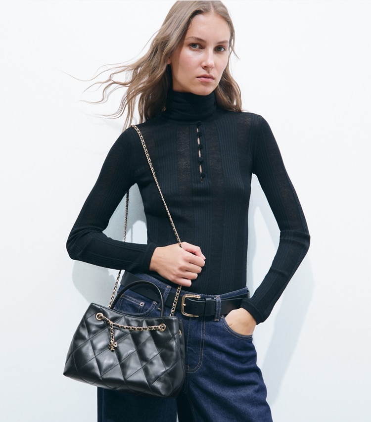 Tory Burch designer crossbody bags Small Fleming Carryall in Black accessory on model