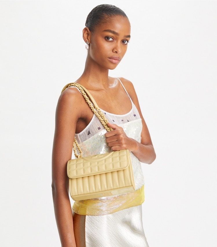 Tory Burch designer shoulder bags Small Fleming Patent Square Quilt Convertible Shoulder Bag in Vanilla Soft Serve accessory on model