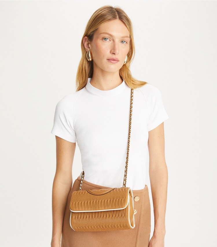 Tory Burch designer shoulder bags Small Fleming Soft Pleated Convertible Shoulder Bag in DUSTY ALMOND additional on model